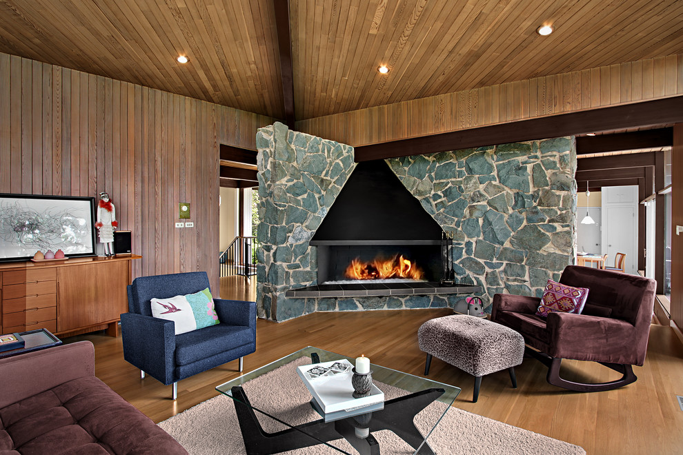 Design ideas for a midcentury living room in Seattle with a corner fireplace.