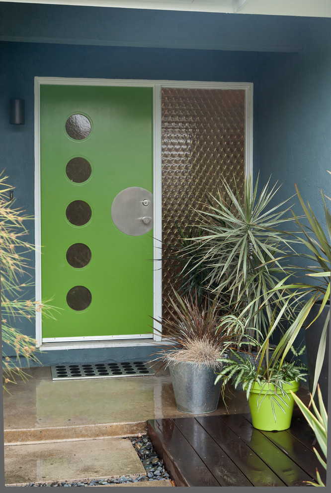 This is an example of a midcentury entryway in Other.