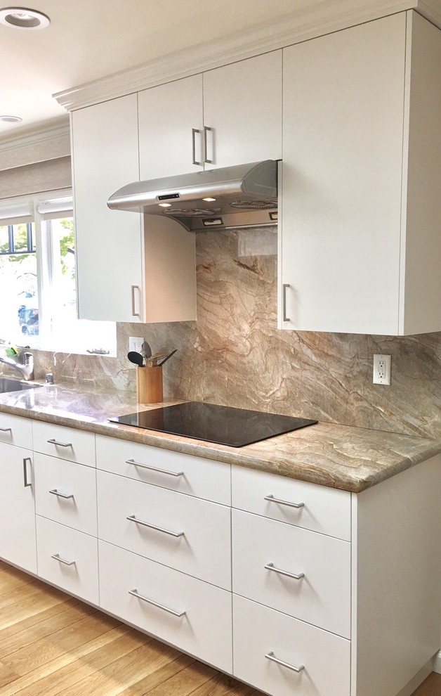 Inspiration for a mid-sized contemporary galley eat-in kitchen in San Francisco with flat-panel cabinets, white cabinets, granite benchtops, brown splashback, stone slab splashback, stainless steel appliances, medium hardwood floors and a peninsula.