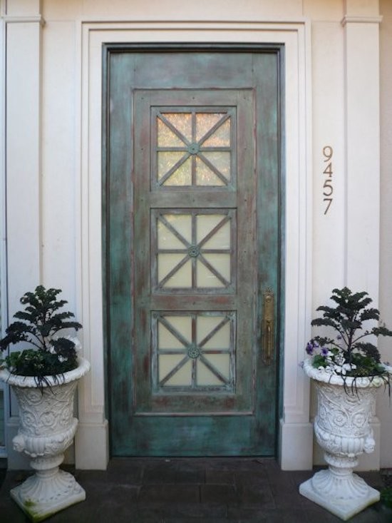 This is an example of a small contemporary entryway in Seattle with a single front door and a metal front door.