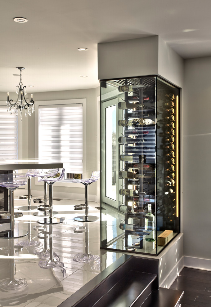 This is an example of a small contemporary wine cellar in Montreal.