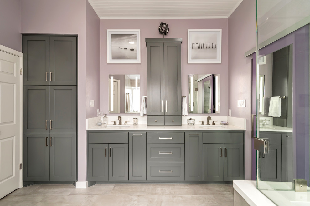 Inspiration for a mid-sized contemporary master bathroom in Austin with shaker cabinets, grey cabinets, a freestanding tub, a corner shower, a one-piece toilet, porcelain tile, porcelain floors, an undermount sink, engineered quartz benchtops, multi-coloured floor, a hinged shower door and white benchtops.