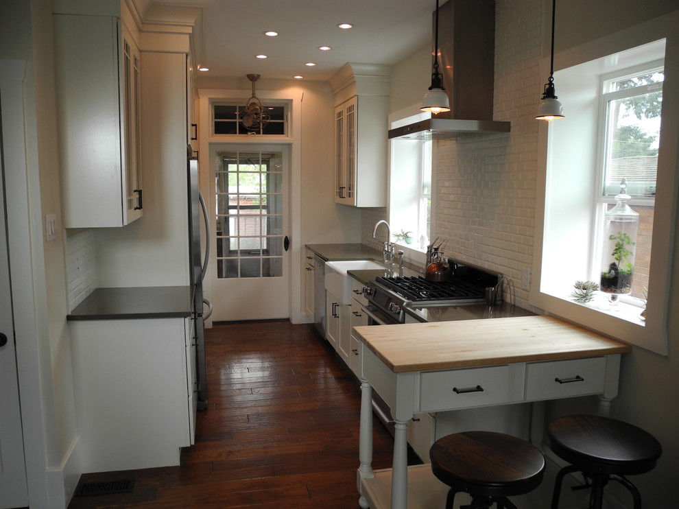 Inspiration for a small country galley eat-in kitchen in Denver with a farmhouse sink, shaker cabinets, white cabinets, quartz benchtops, white splashback, stainless steel appliances and medium hardwood floors.