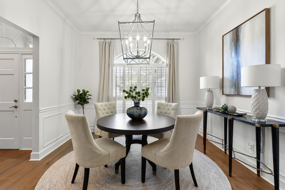 Inspiration for a mid-sized transitional separate dining room in Jacksonville with grey walls, medium hardwood floors and brown floor.