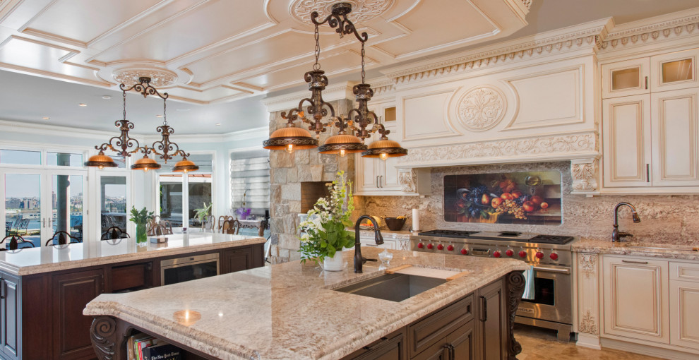This is an example of a large traditional u-shaped eat-in kitchen in New York with an integrated sink, shaker cabinets, beige cabinets, quartz benchtops, beige splashback, engineered quartz splashback, stainless steel appliances, multiple islands, brown floor, beige benchtop and coffered.