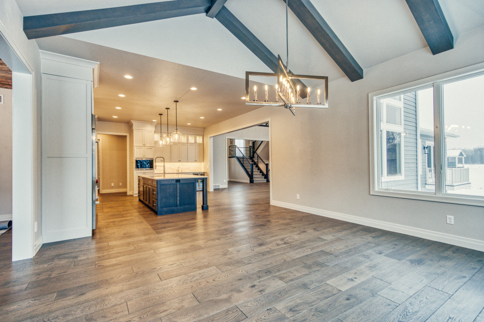 Inspiration for a large transitional medium tone wood floor and brown floor kitchen/dining room combo remodel with gray walls and no fireplace