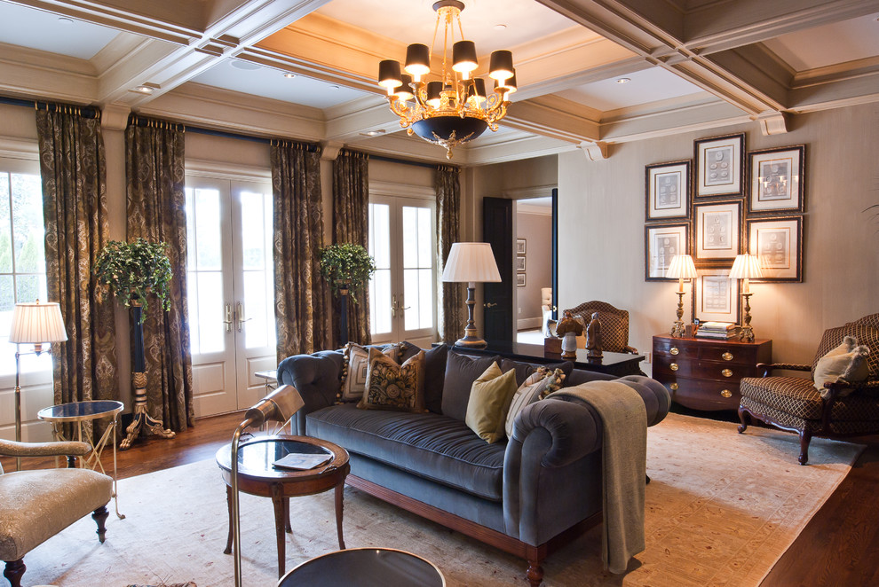 Photo of a traditional living room in Nashville with beige walls and dark hardwood floors.
