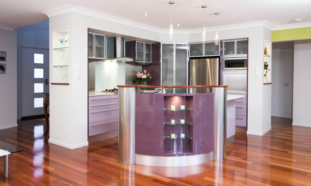 Inspiration for a contemporary kitchen in Brisbane with glass-front cabinets and stainless steel appliances.