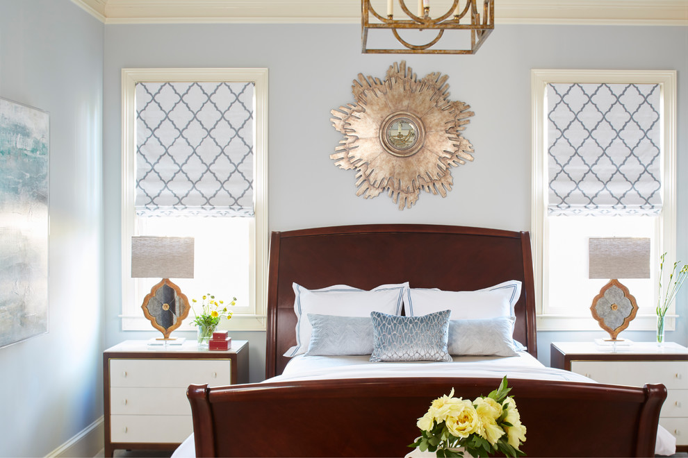 This is an example of a transitional guest bedroom in Atlanta with blue walls.
