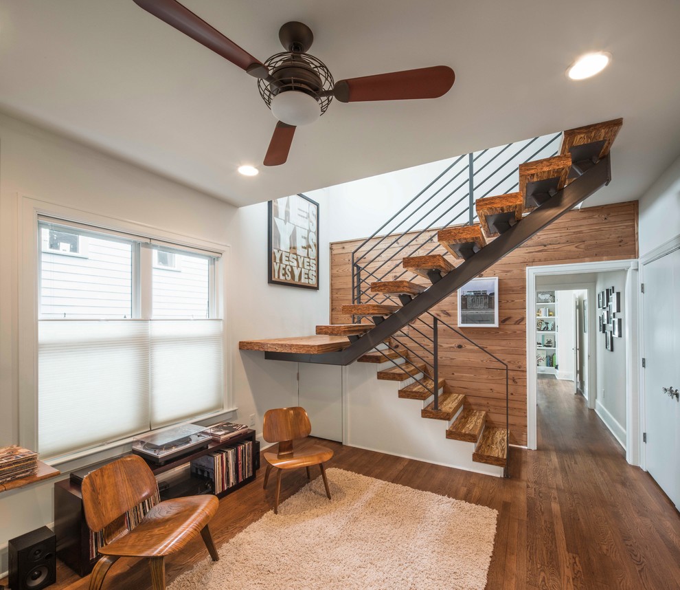 Photo of a midcentury wood u-shaped staircase in Austin.