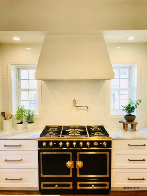 Inspiration for a transitional kitchen remodel in DC Metro with flat-panel cabinets and white cabinets