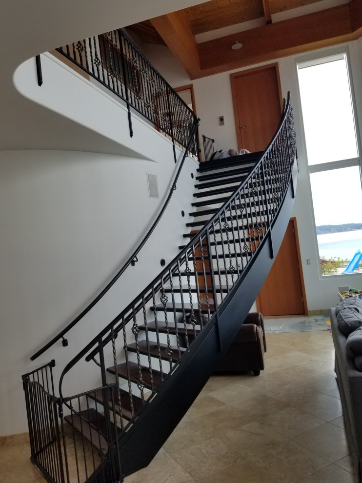 Mid-sized minimalist porcelain tile and beige floor staircase photo with white walls