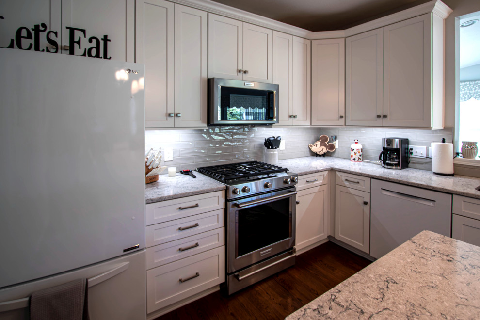 White Shaker Kitchen w/ Pietra Quartz Countertop and Gray Subway Tile ...