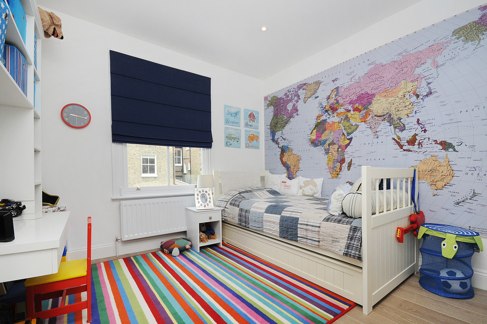 Inspiration for a traditional kids' bedroom for boys in London with white walls.