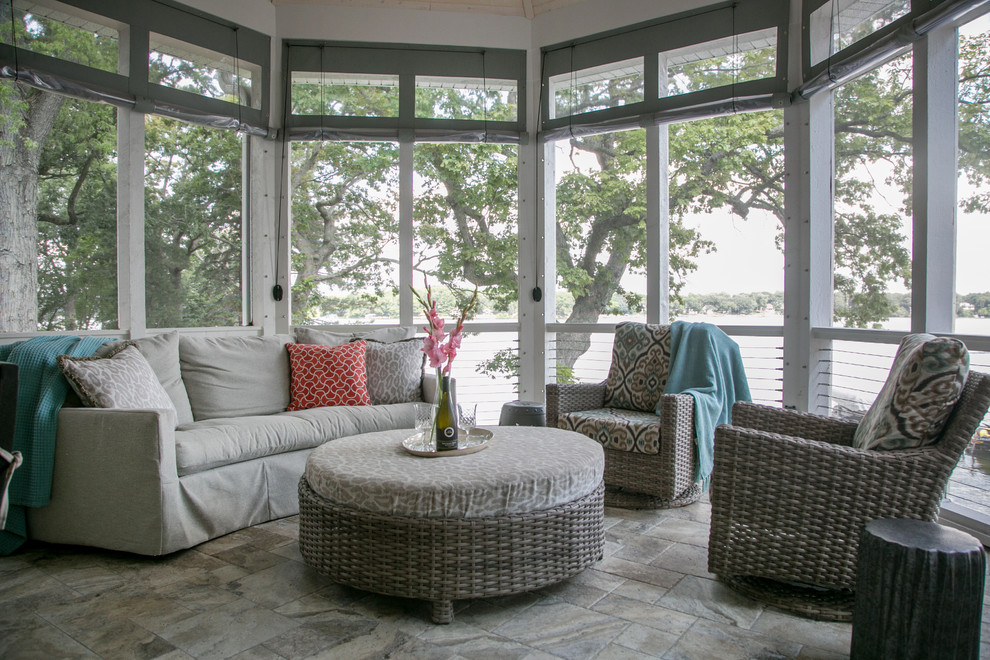 Design ideas for a large transitional backyard screened-in verandah in Milwaukee with tile.