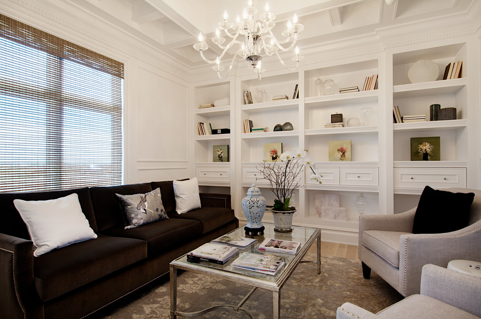 This is an example of a mid-sized traditional formal enclosed living room in Calgary with white walls, no fireplace, no tv, light hardwood floors and beige floor.
