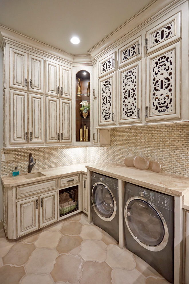 Design ideas for a mediterranean l-shaped dedicated laundry room in Dallas with an undermount sink, raised-panel cabinets, light wood cabinets, quartzite benchtops, beige walls, concrete floors, a side-by-side washer and dryer and beige floor.