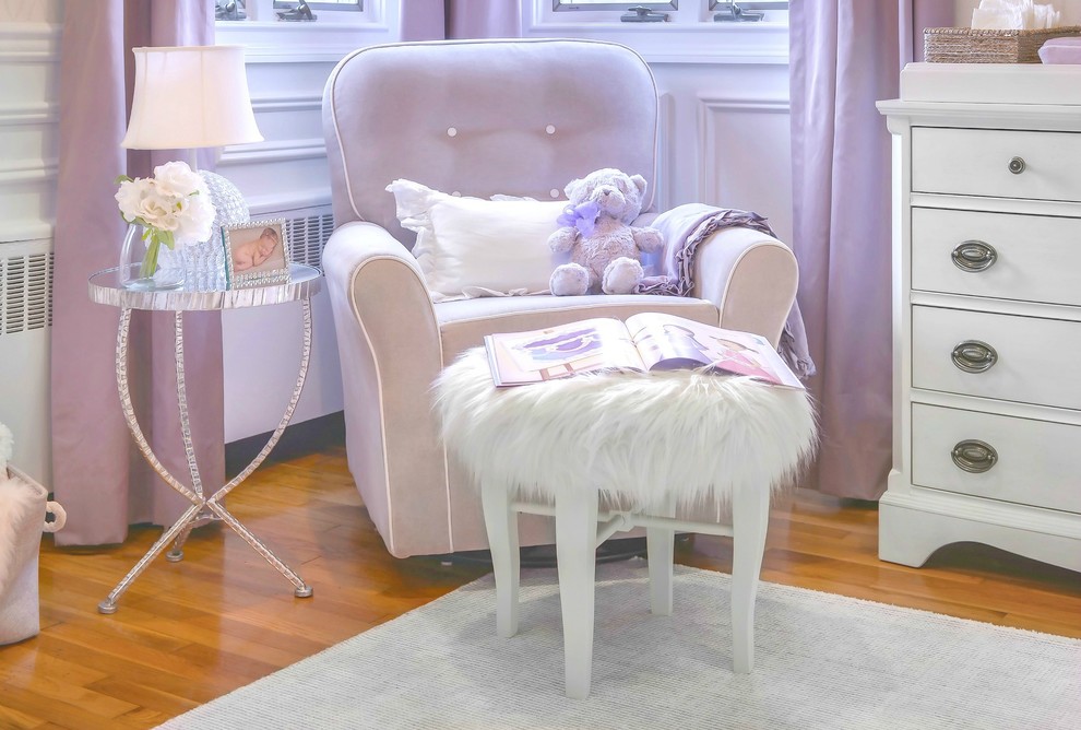 Inspiration for a mid-sized transitional nursery for girls in New York with white walls and carpet.