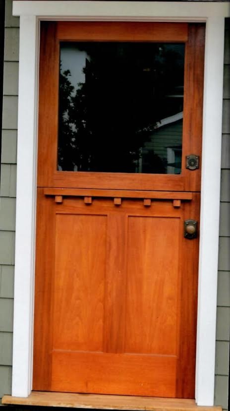 This is an example of a mid-sized traditional front door in Orange County with a dutch front door and a medium wood front door.