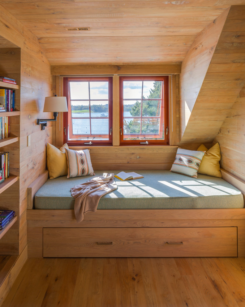 Design ideas for a country bedroom in Boston with medium hardwood floors, brown walls and no fireplace.