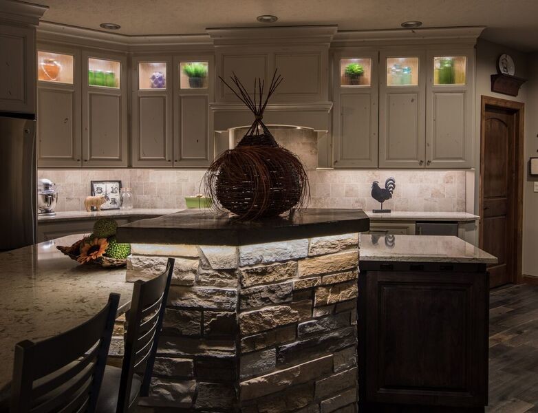 Inspiration for a mid-sized transitional open concept kitchen remodel with an undermount sink, raised-panel cabinets, white cabinets, quartz countertops, stainless steel appliances and an island