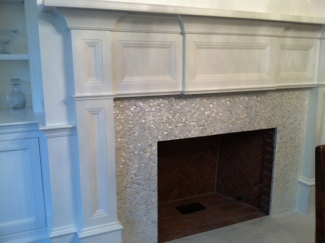 mother of pearl mosaic fireplace surround with asian statuary hearth