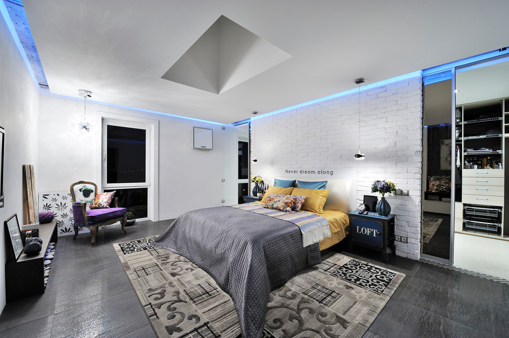 Photo of a contemporary bedroom in Other with white walls.