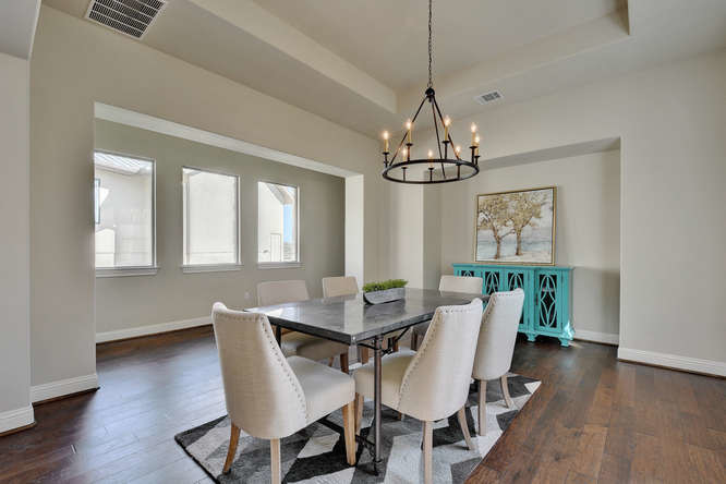 Large transitional separate dining room in Austin with beige walls, dark hardwood floors and no fireplace.