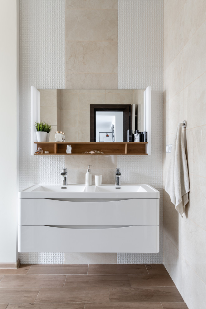 This is an example of a small contemporary 3/4 bathroom in Moscow with beaded inset cabinets, white cabinets, an undermount tub, a curbless shower, beige tile, stone tile, white walls, wood-look tile, a console sink, laminate benchtops, brown floor, an open shower, white benchtops, a niche, a double vanity, a floating vanity and a two-piece toilet.