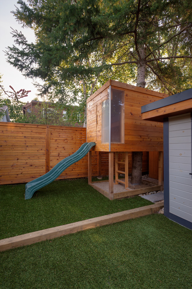 Inspiration for a contemporary garden in Toronto with with outdoor playset.