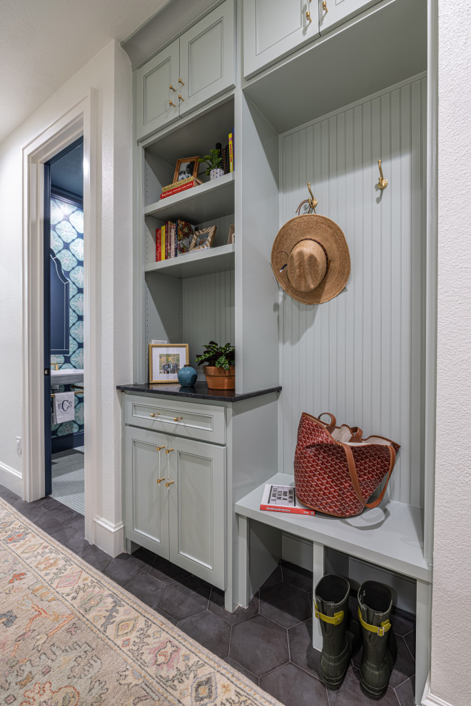 Inspiration for a small transitional porcelain tile, gray floor and wall paneling hallway remodel in Dallas with green walls