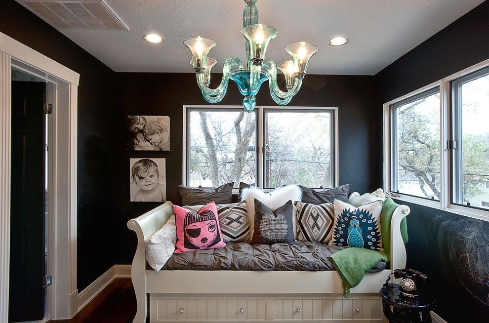 Design ideas for a contemporary kids' playroom in Austin with black walls.