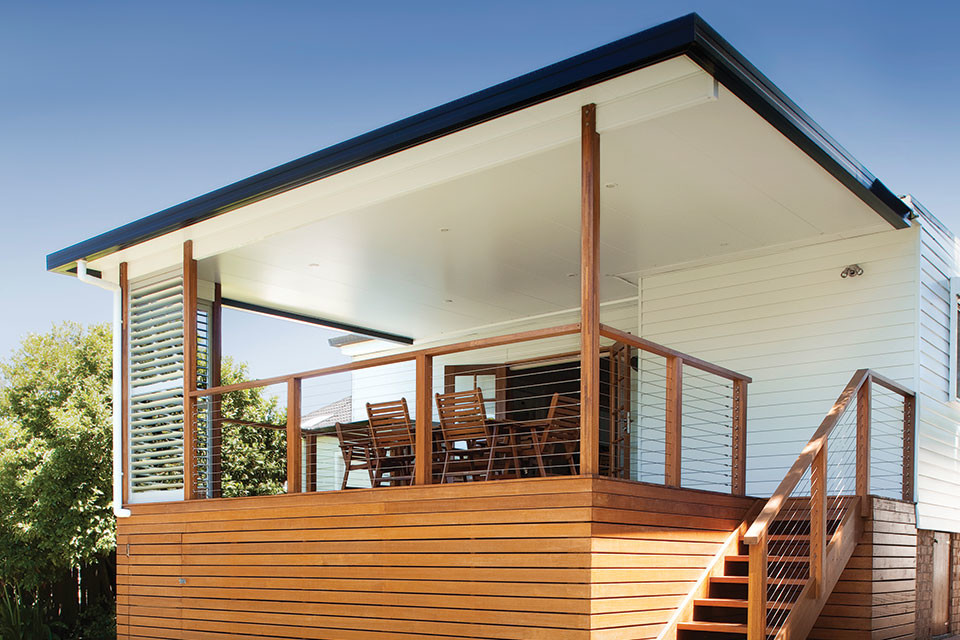 Photo of a mid-sized modern backyard patio in Melbourne with decking and a roof extension.