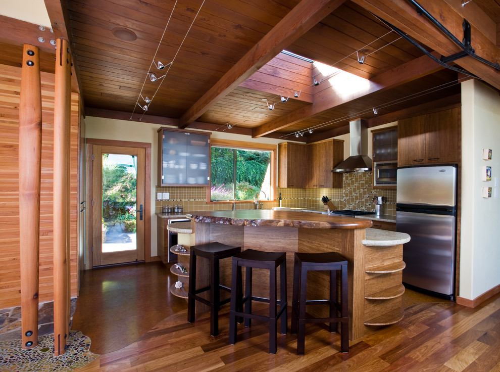 Photo of a mid-sized country open plan kitchen in San Francisco with flat-panel cabinets, medium wood cabinets, with island, an undermount sink, quartz benchtops, multi-coloured splashback, glass tile splashback and cork floors.