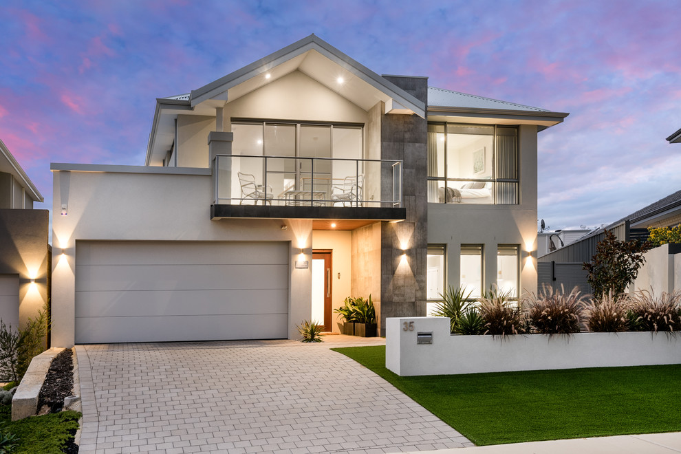 Design ideas for a large contemporary two-storey white exterior in Perth with stone veneer and a hip roof.