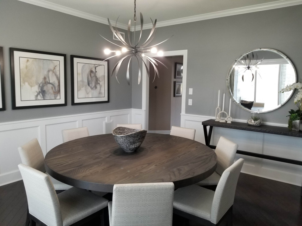 Enclosed dining room - mid-sized contemporary dark wood floor, brown floor and wainscoting enclosed dining room idea in Chicago with gray walls