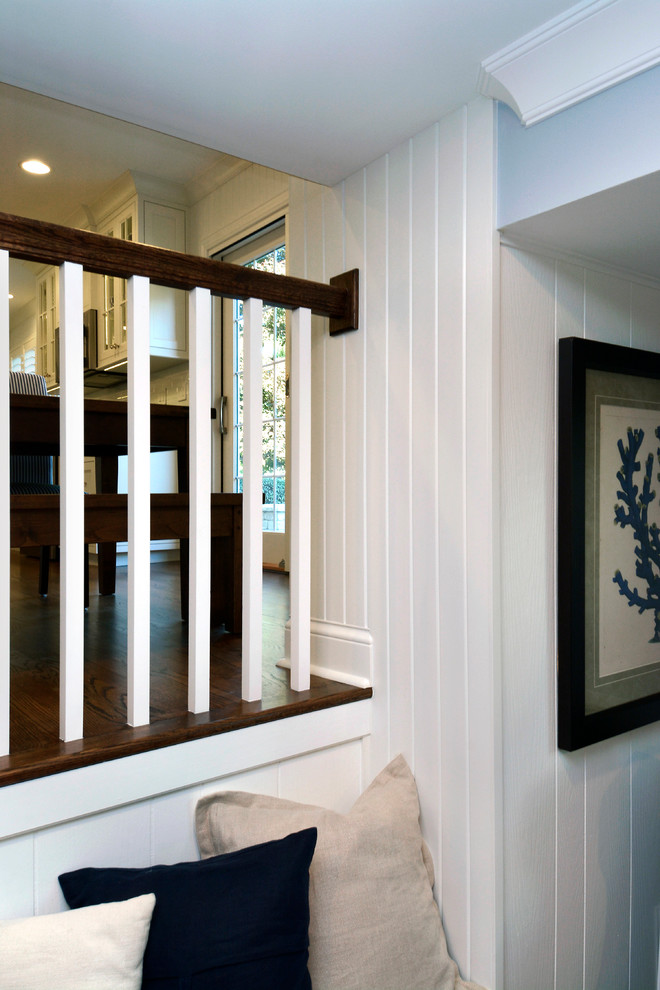 Basement - mid-sized transitional look-out carpeted basement idea in Chicago with white walls, a standard fireplace and a stone fireplace