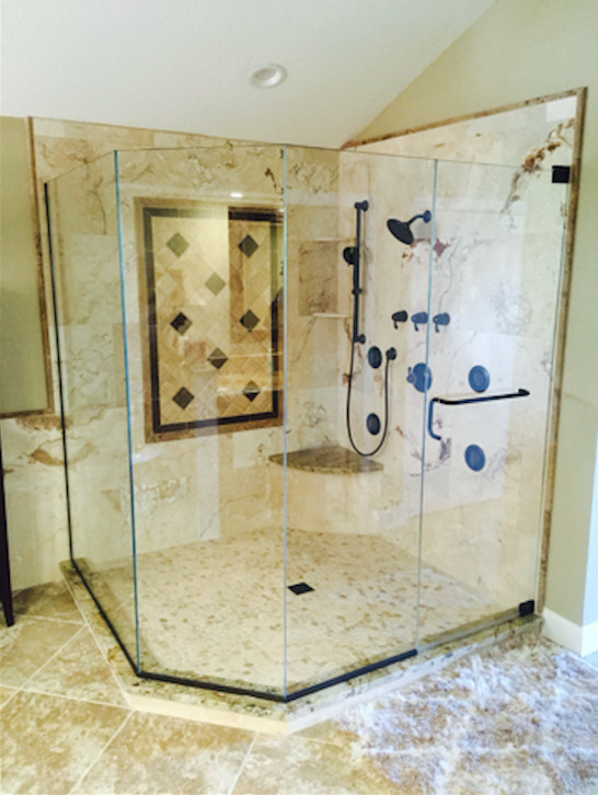 Photo of a mid-sized mediterranean master bathroom in Tampa with beige tile, limestone, beige walls and limestone floors.