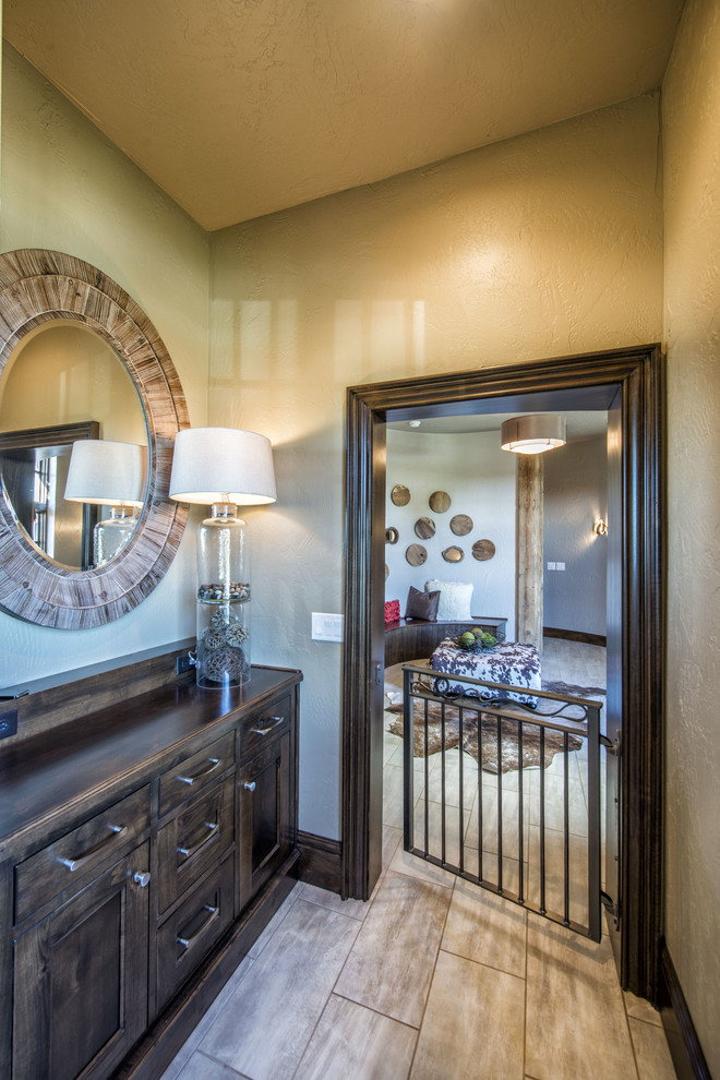 Example of a mid-sized mountain style porcelain tile and beige floor hallway design with beige walls