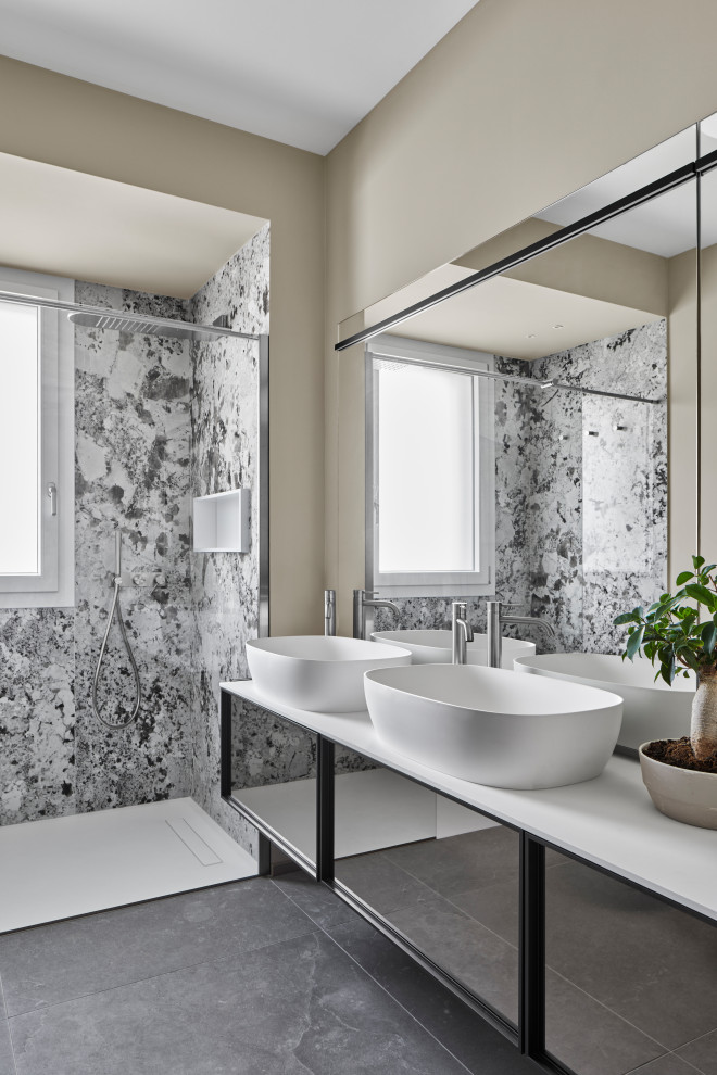 Mid-sized contemporary 3/4 bathroom in Milan with glass-front cabinets, a curbless shower, porcelain tile, porcelain floors, a vessel sink, grey floor, white benchtops, a niche, a floating vanity, recessed, solid surface benchtops and a double vanity.