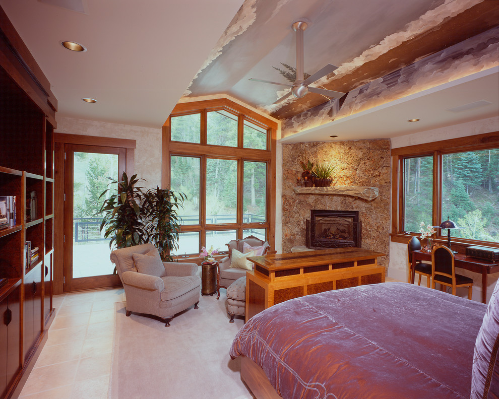 This is an example of a large contemporary master bedroom in Denver with white walls, ceramic floors, a standard fireplace and a stone fireplace surround.