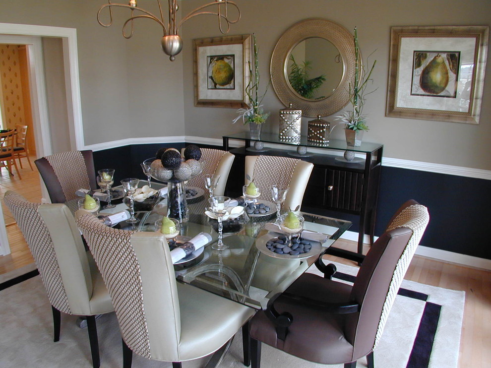 Inspiration for a traditional dining room in DC Metro with beige walls and light hardwood floors.