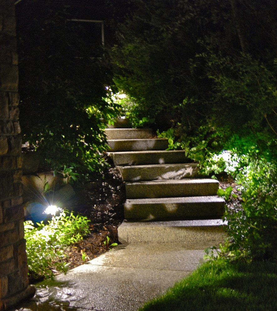 Inspiration for a mid-sized rustic front yard concrete paver garden path in Calgary.