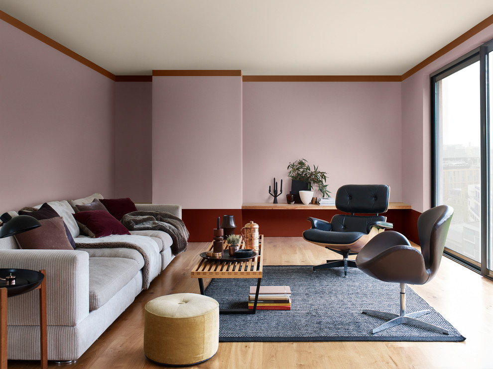 Midcentury formal enclosed living room with purple walls, light hardwood floors and beige floor.
