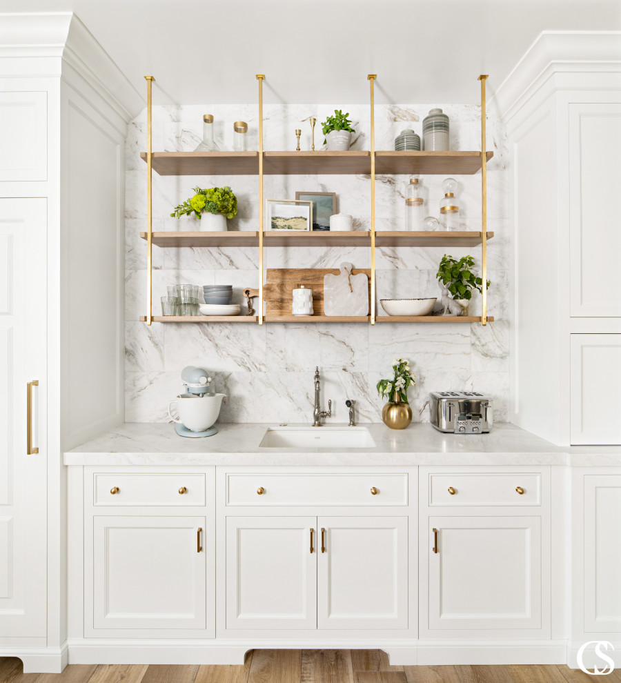 Kitchen pantry in Salt Lake City with a drop-in sink, shaker cabinets, white cabinets, marble benchtops, white splashback, marble splashback, panelled appliances, medium hardwood floors and white benchtop.