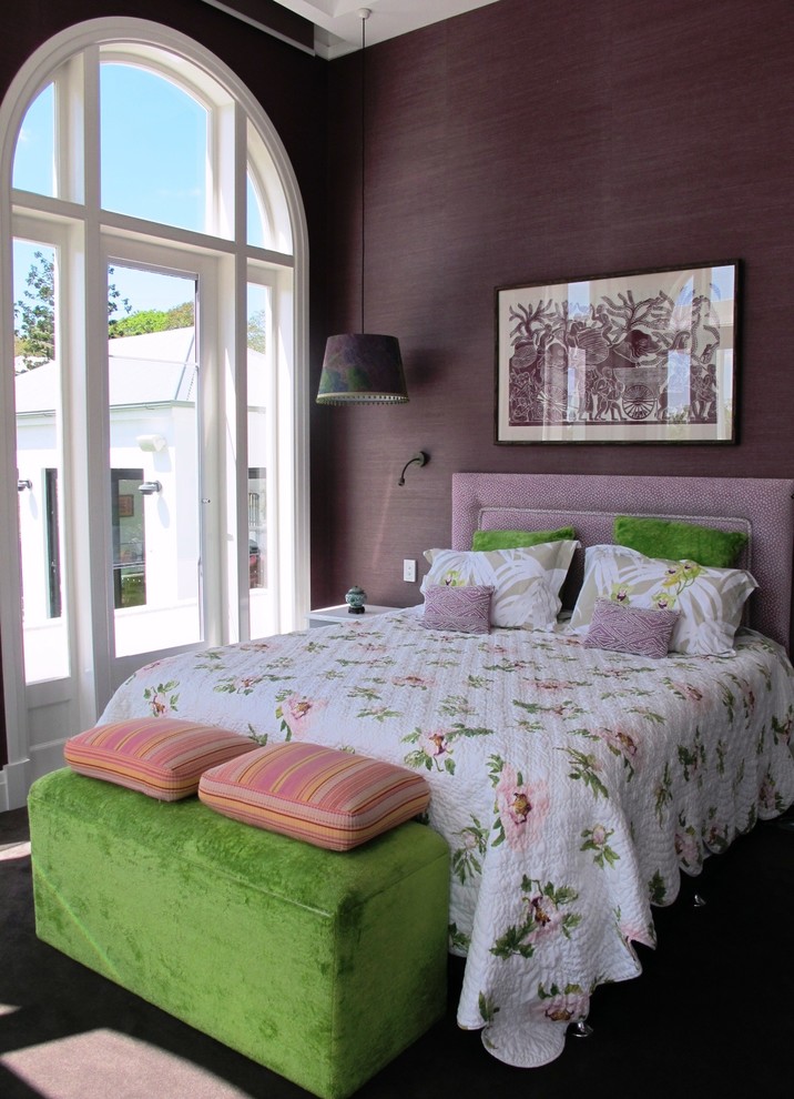 This is an example of a transitional bedroom in Brisbane with purple walls and carpet.