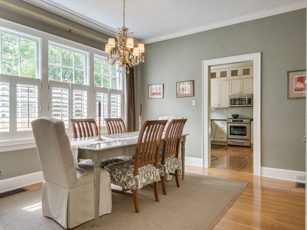 Inspiration for a traditional dining room in Charlotte with grey walls.