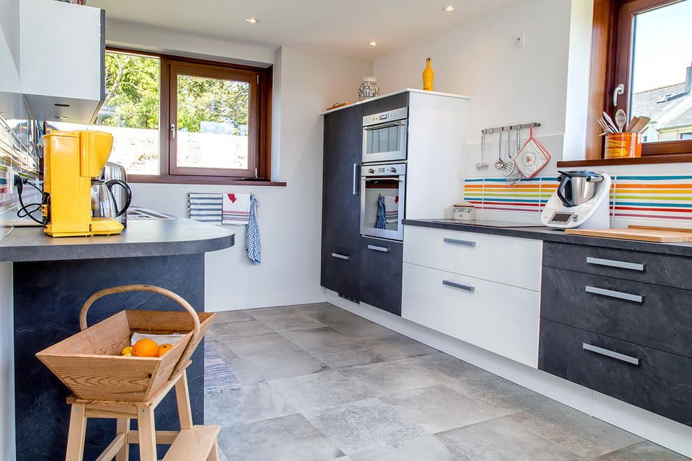 Inspiration for a mid-sized contemporary galley kitchen in Brest with an integrated sink, multi-coloured splashback, ceramic splashback, stainless steel appliances, ceramic floors, flat-panel cabinets and white cabinets.