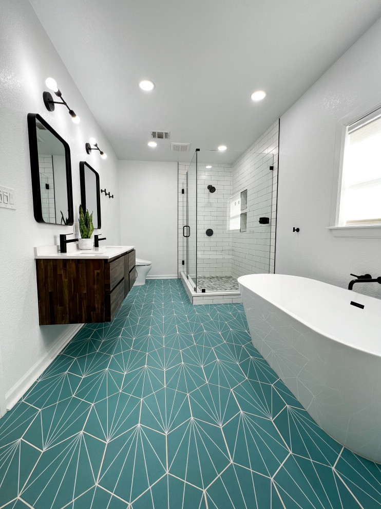 This is an example of a mid-sized modern master bathroom in Austin with flat-panel cabinets, dark wood cabinets, a freestanding tub, a corner shower, a bidet, white tile, white walls, porcelain floors, an undermount sink, engineered quartz benchtops, turquoise floor, a hinged shower door, white benchtops, a double vanity and a floating vanity.