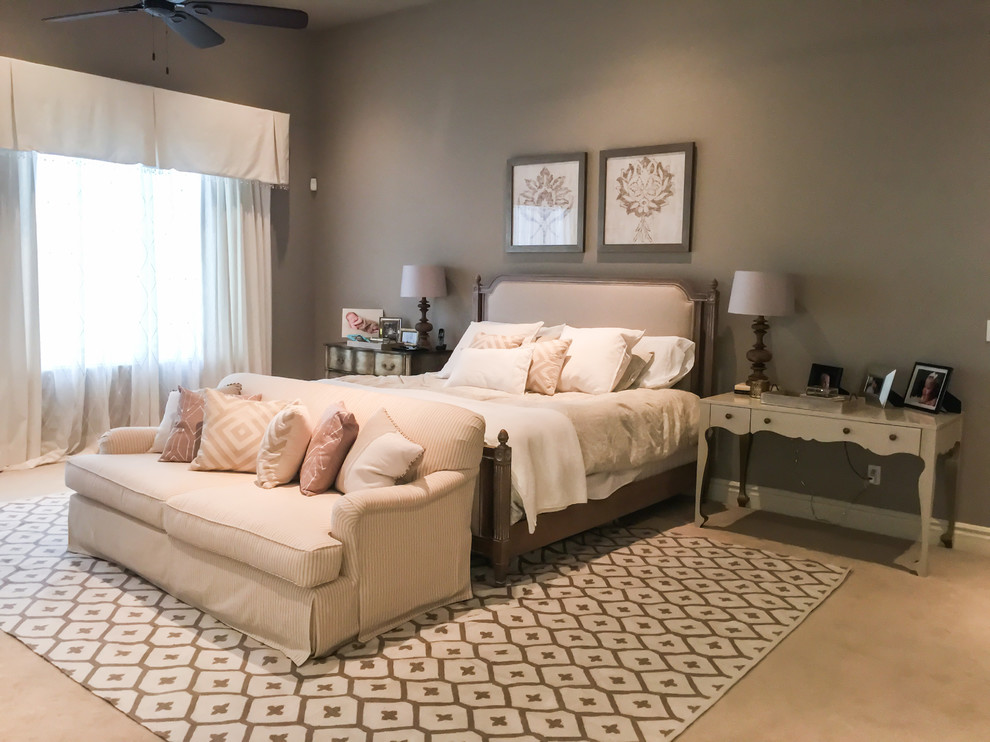 This is an example of a mid-sized transitional master bedroom in Phoenix with brown walls, carpet and brown floor.